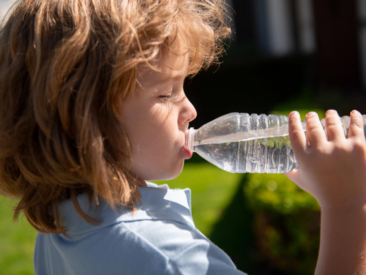 Child drinking water from a bottle