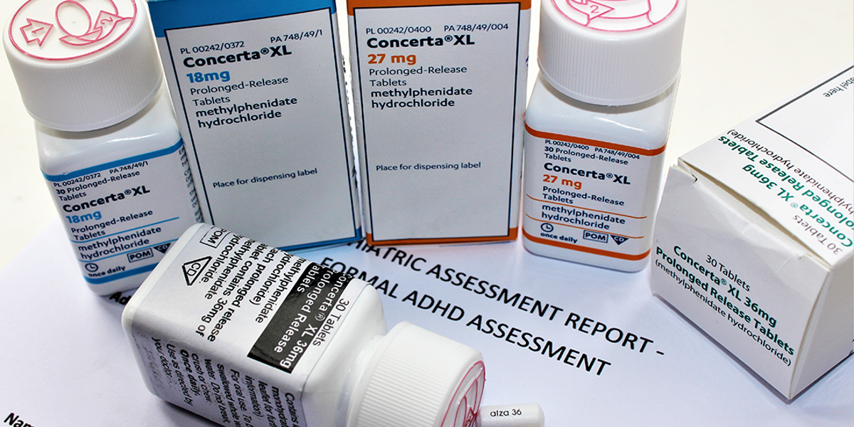 ADHD medication (Concerta) boxes and pill containers.